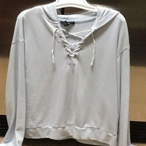 Blue long sleeve shirt with a hood